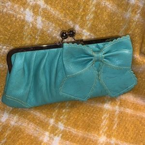 Jessica Simpson. The cutest clutch ever!! Holds a lot . Perfect aqua